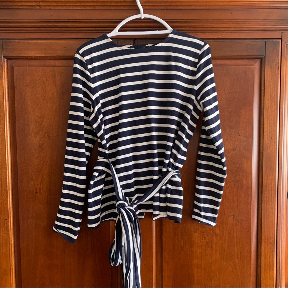 J Crew long sleeve white and navy stripes shirt with back cut.